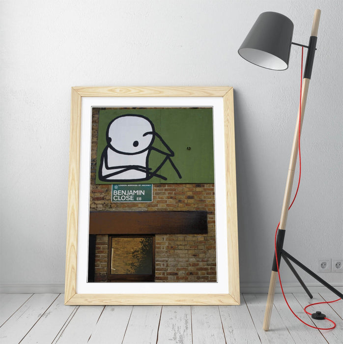 Framed Wall Art – STIK Stick Man Sitting Graffiti Print on Matte Paper