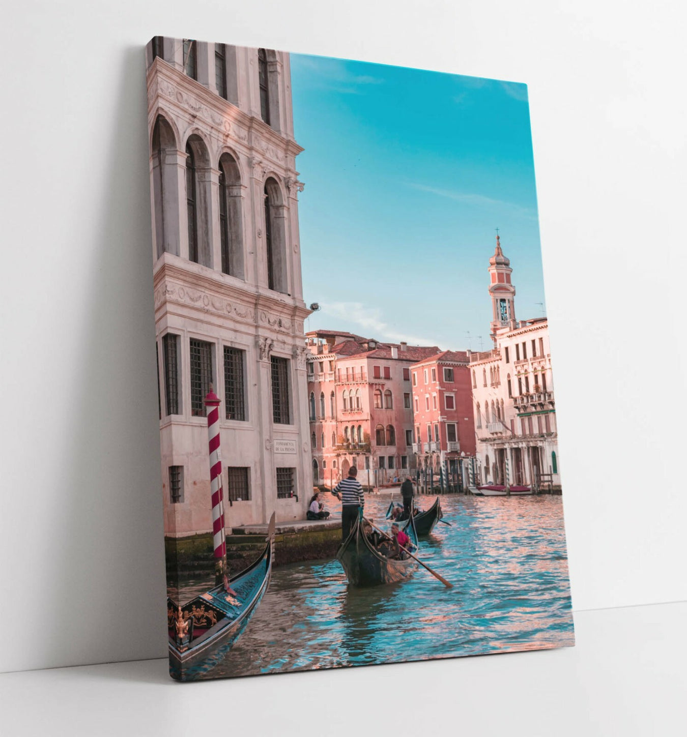 Canvas print of a scenic view of a canal with gondolas and buildings in the background.