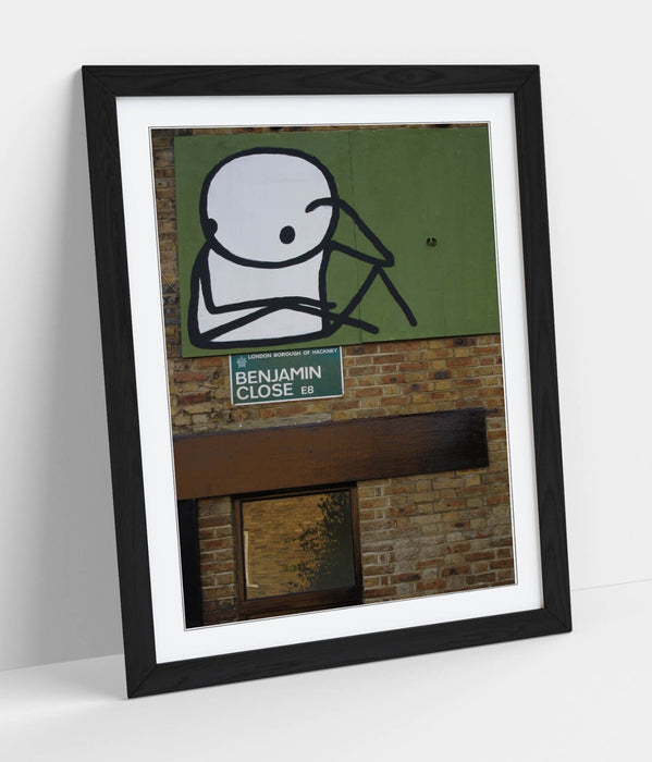 Framed Wall Art – STIK Stick Man Sitting Graffiti Print on Matte Paper