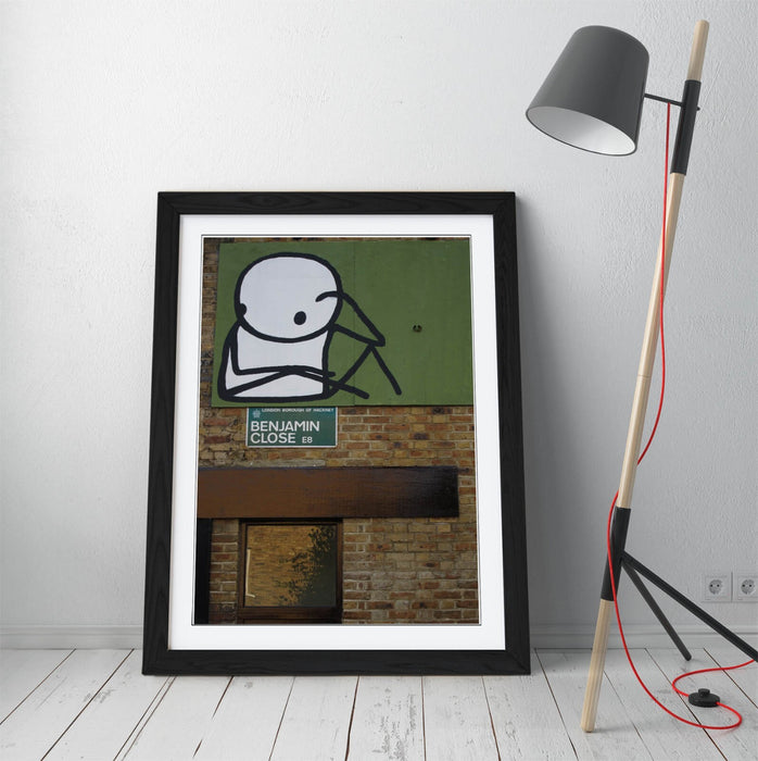 Framed Wall Art – STIK Stick Man Sitting Graffiti Print on Matte Paper