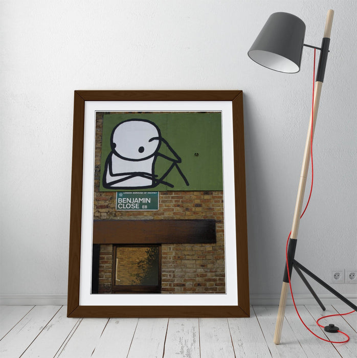 Framed Wall Art – STIK Stick Man Sitting Graffiti Print on Matte Paper