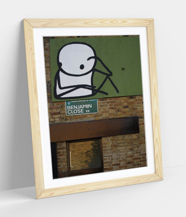 Framed Wall Art – STIK Stick Man Sitting Graffiti Print on Matte Paper